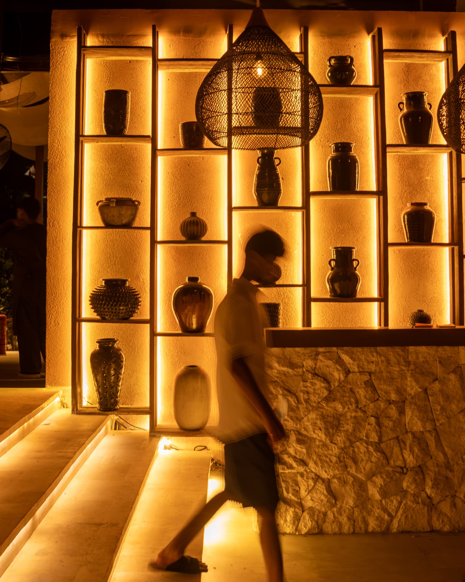 Evening glow over the TAMAN bar with a guest passing by